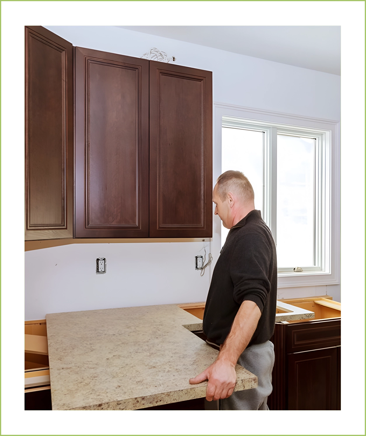 A man is standing in front of the counter.