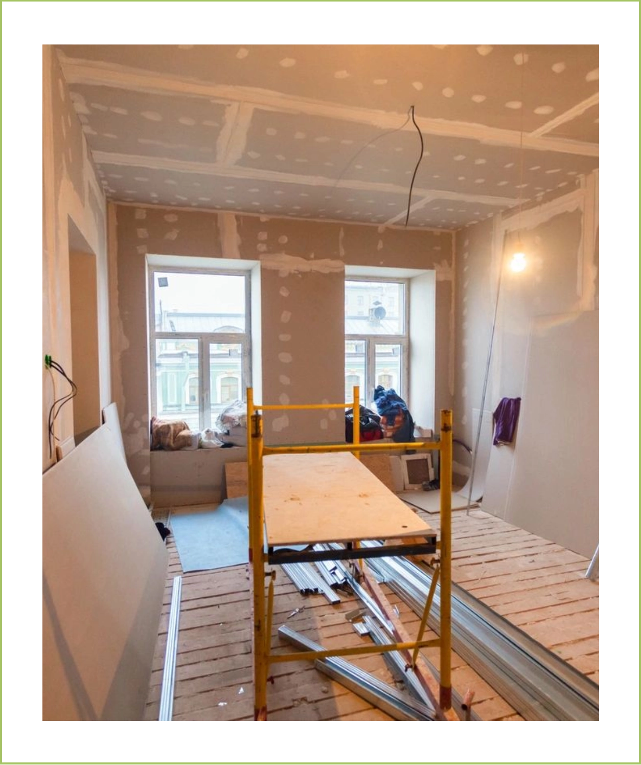 A room being remodeled with the walls and ceiling in place.