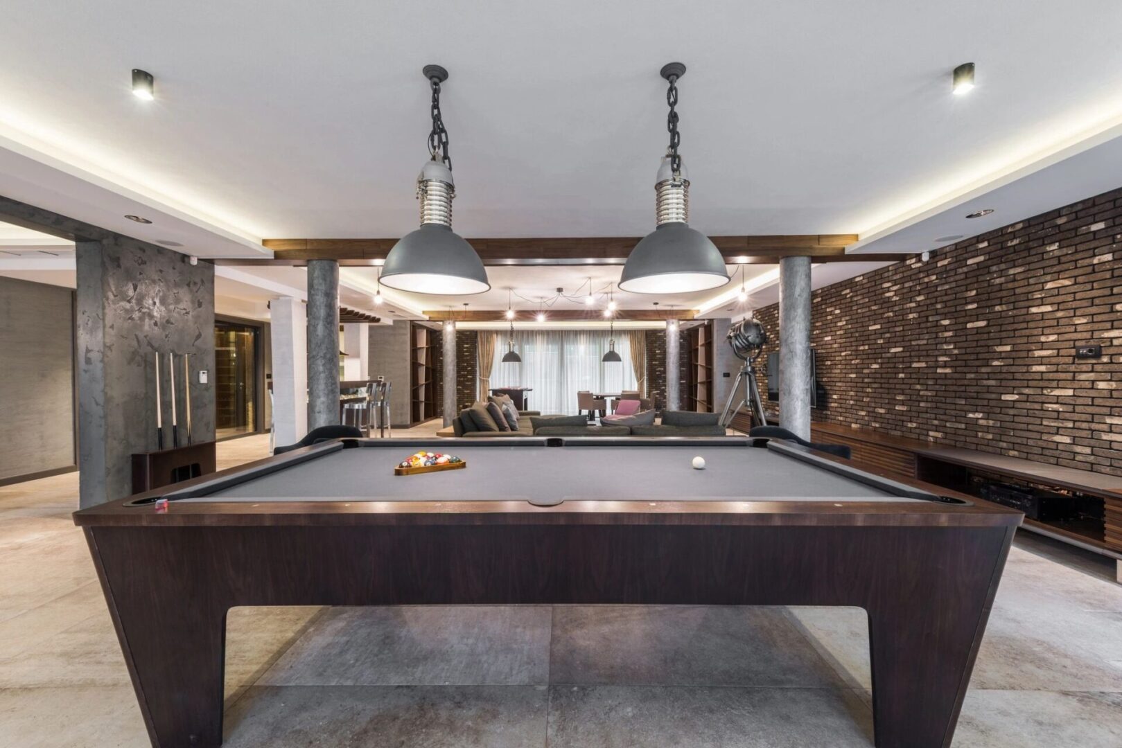 A pool table in the middle of a room.